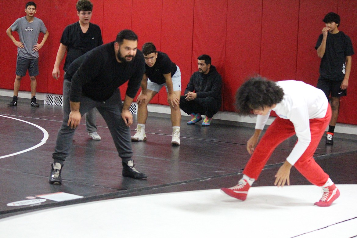 Lutacaga Elementary teacher and Othello head wrestling coach Rudy Ochoa II gives instructions to the team on the first night of practice.