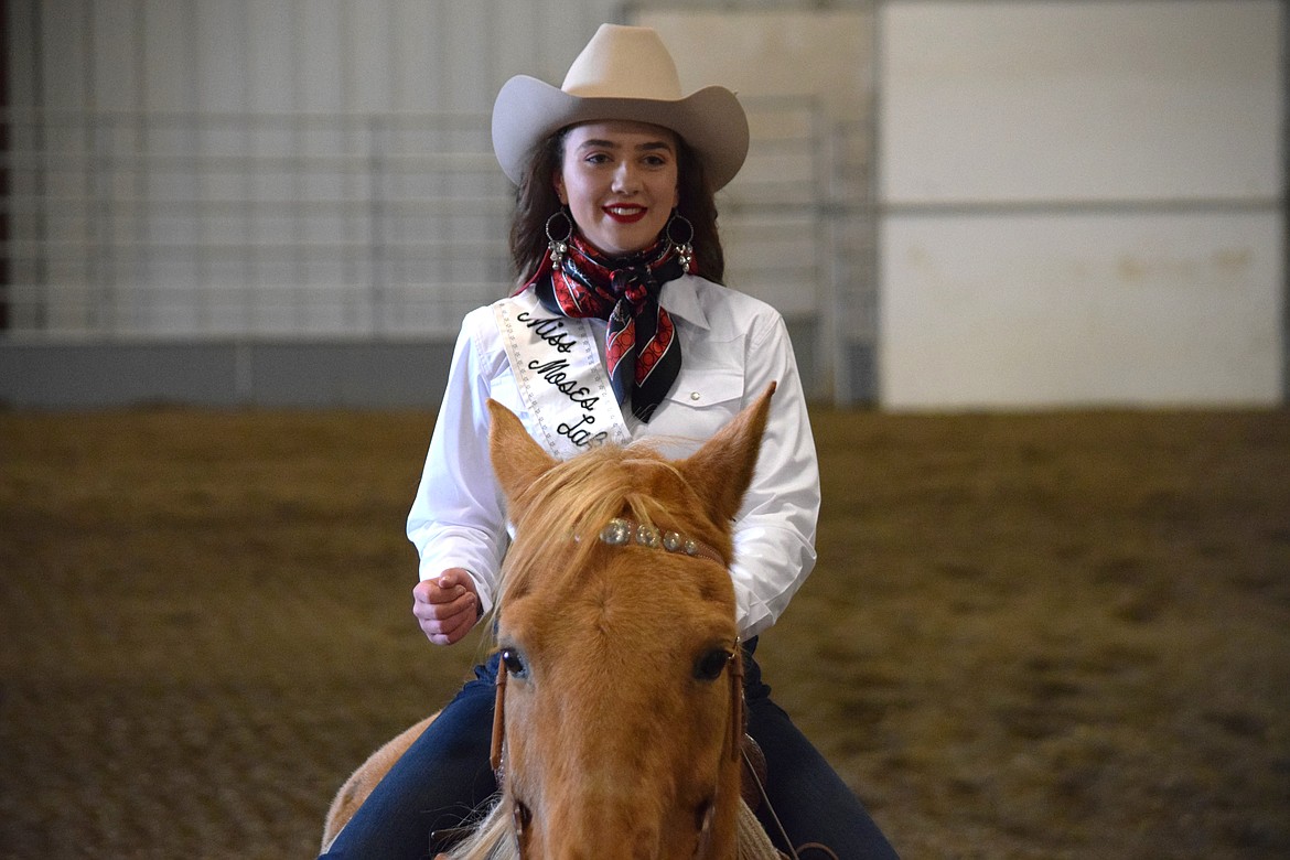 Contestant Jenna Penrose after finishing riding a pattern as part of the horsemanship portion of the Miss Moses Lake Roundup competition on Saturday. Penrose won the pageant’s congeniality award.