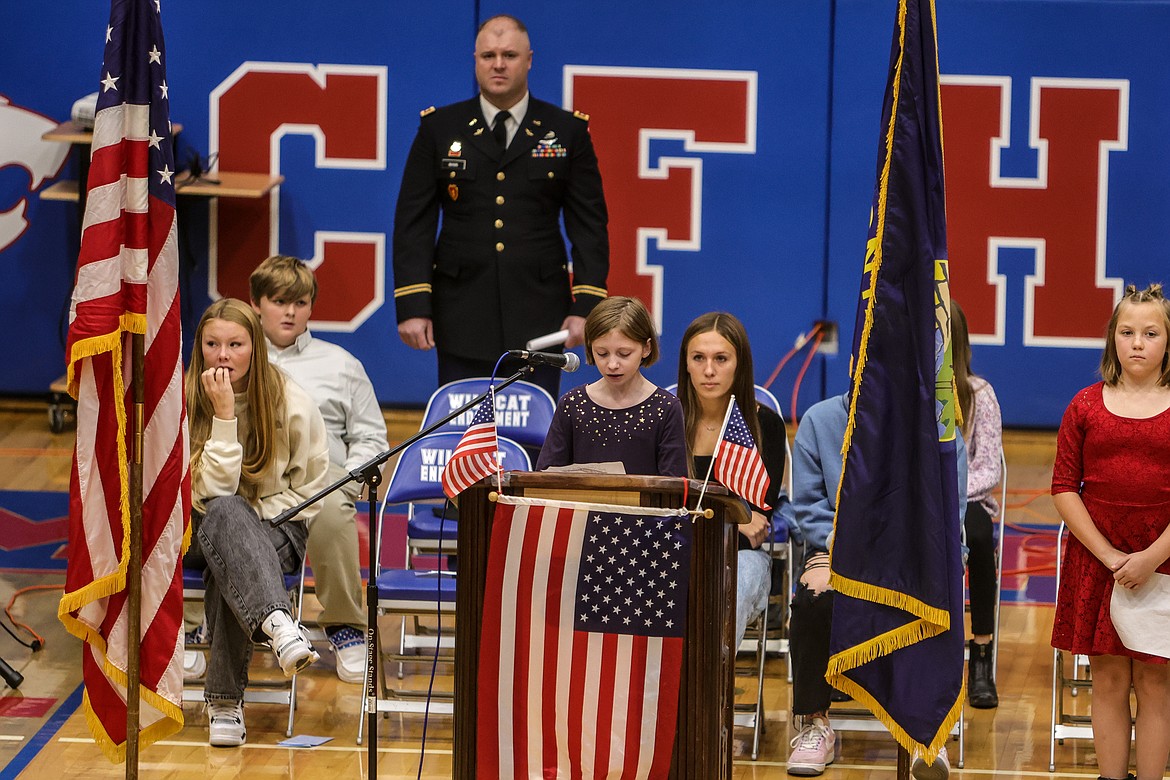 Olivia Cleveland reads her Veteran's Day poem at the assembly on Thursday. (JP Edge photo)