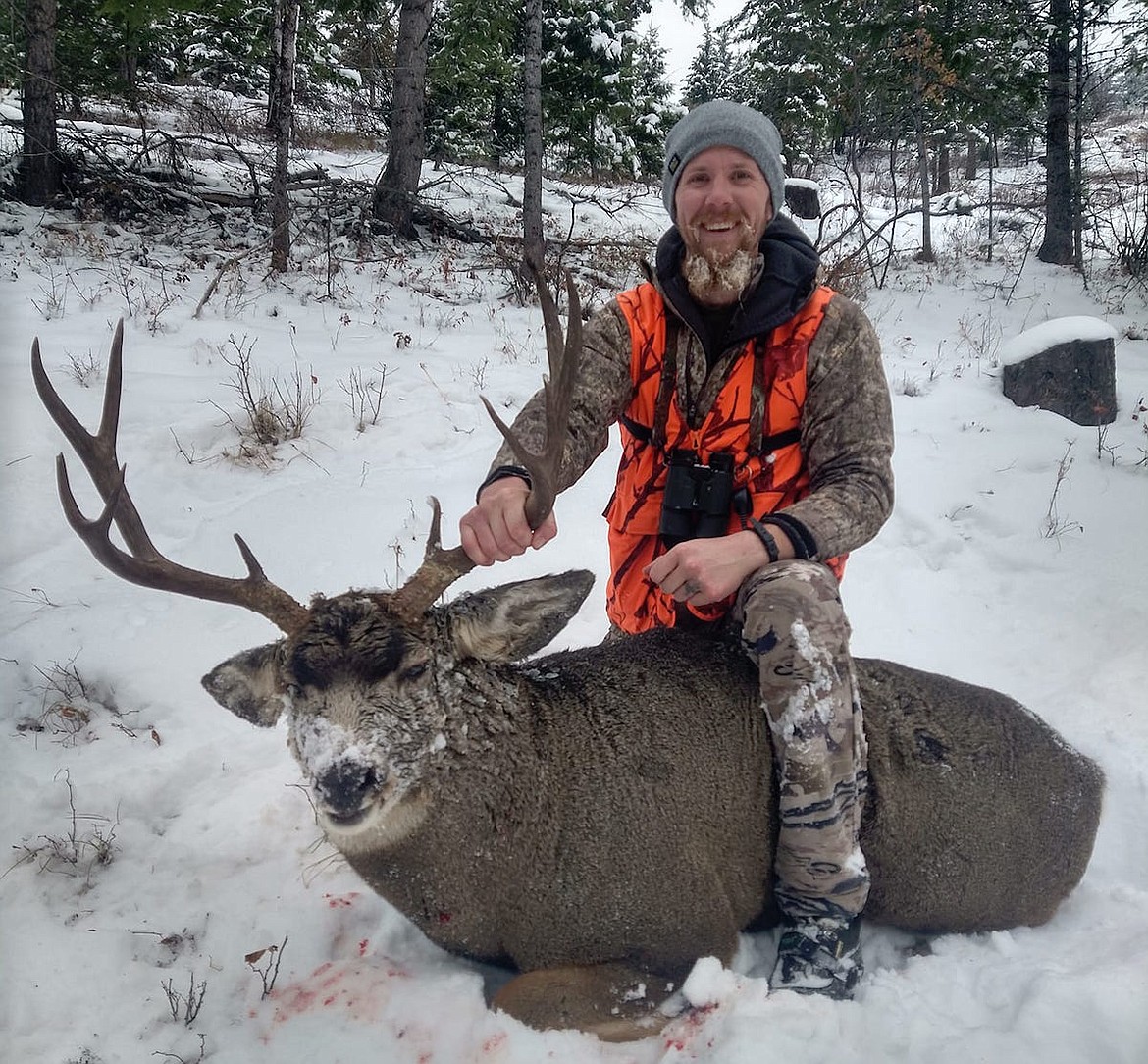 Libby resident Scott Hanson shows off the 5x5 mule deer buck he bagged on Monday, Nov. 14.