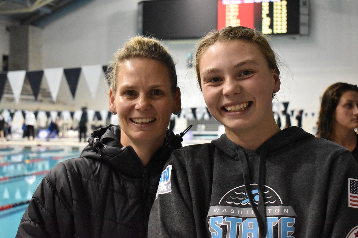 Hollie DuVall (left) and Kathryn DuVall (right) smile together at the WIAA State Swim and Dive Meet this past weekend. Kathryn and the Moses Lake Mavs placed fourth at the state meet.