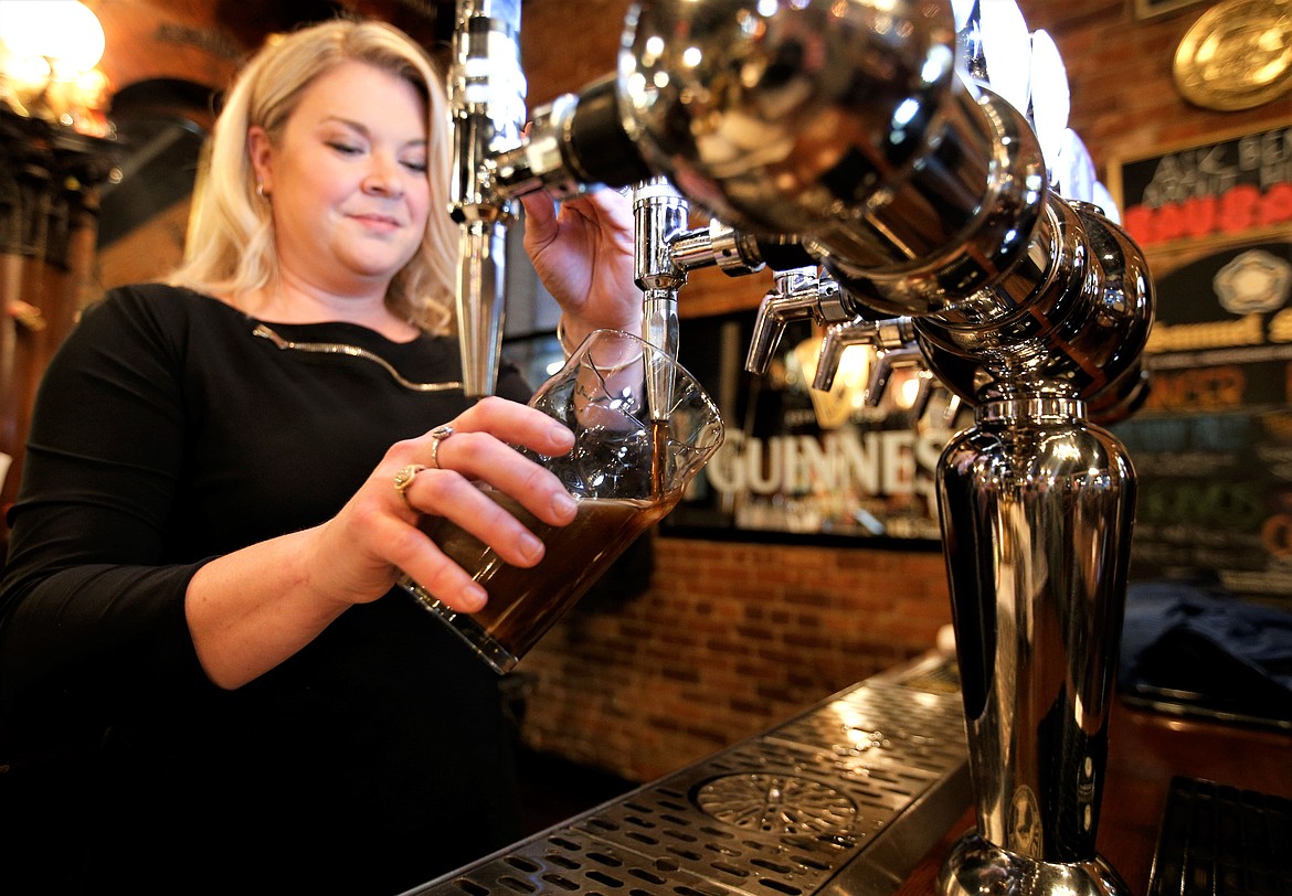 Jennifer Drake pours a Guinness at Crown and Thistle.