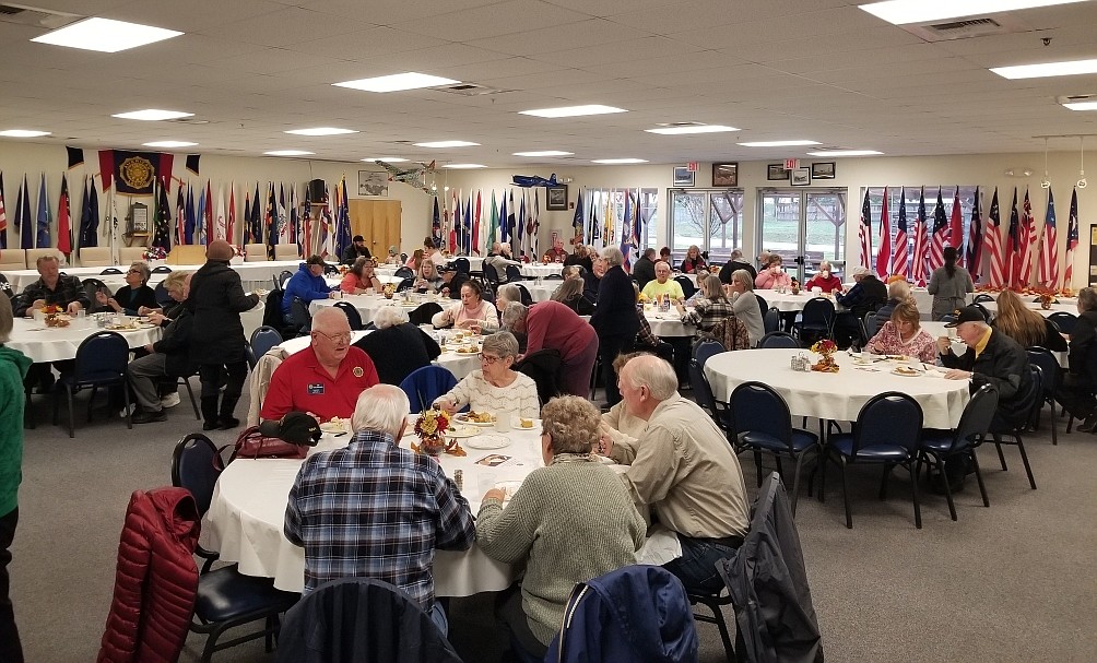 Guests gather in the dining room of the Post Falls American Legion Post 143 for an early Thanksgiving meal in 2021. This year's free community Thanksgiving meal will be from 1-4 p.m. Saturday.