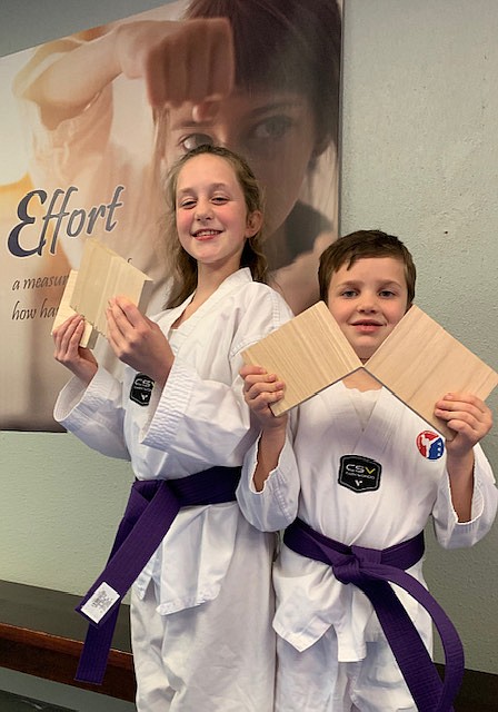 Brother/sister duo, Finnegan and Delaney Peterson earn their purple belt at SMA's October belt testing.
