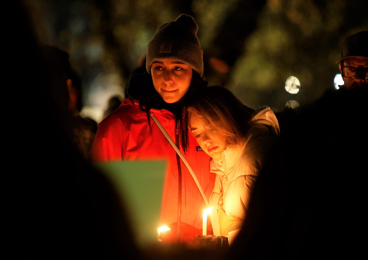 Hundreds of mourners gathered Wednesday night at Independence Point to honor the four University of Idaho students who died in Moscow this week. BILL BULEY/Press