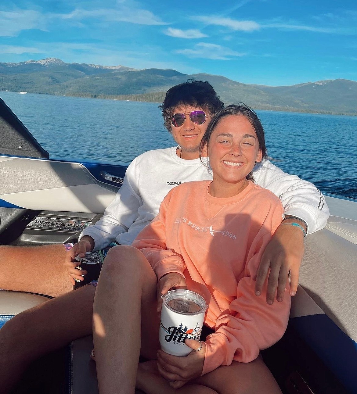 his July 2022 photo provided by Jazzmin Kernodle shows University of Idaho students Xana Kernodle, right, and Ethan Chapin on a boat on Priest Lake, in Idaho. Both students were among four found stabbed to death in an off-campus rental home on Nov. 13. (Jazzmin Kernodle via AP)