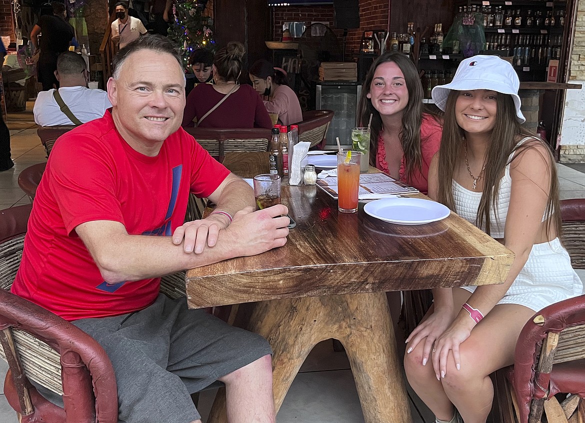 This Dec. 2021 photo provided by Jazzmin Kernodle shows father Jeff Kernodle, left, Xana, middle, and Jazzmin, in Puerto Vallarta, Mexico. Xana was among one of four University of Idaho students found stabbed to death in an off-campus rental home on Nov. 13, 2022.