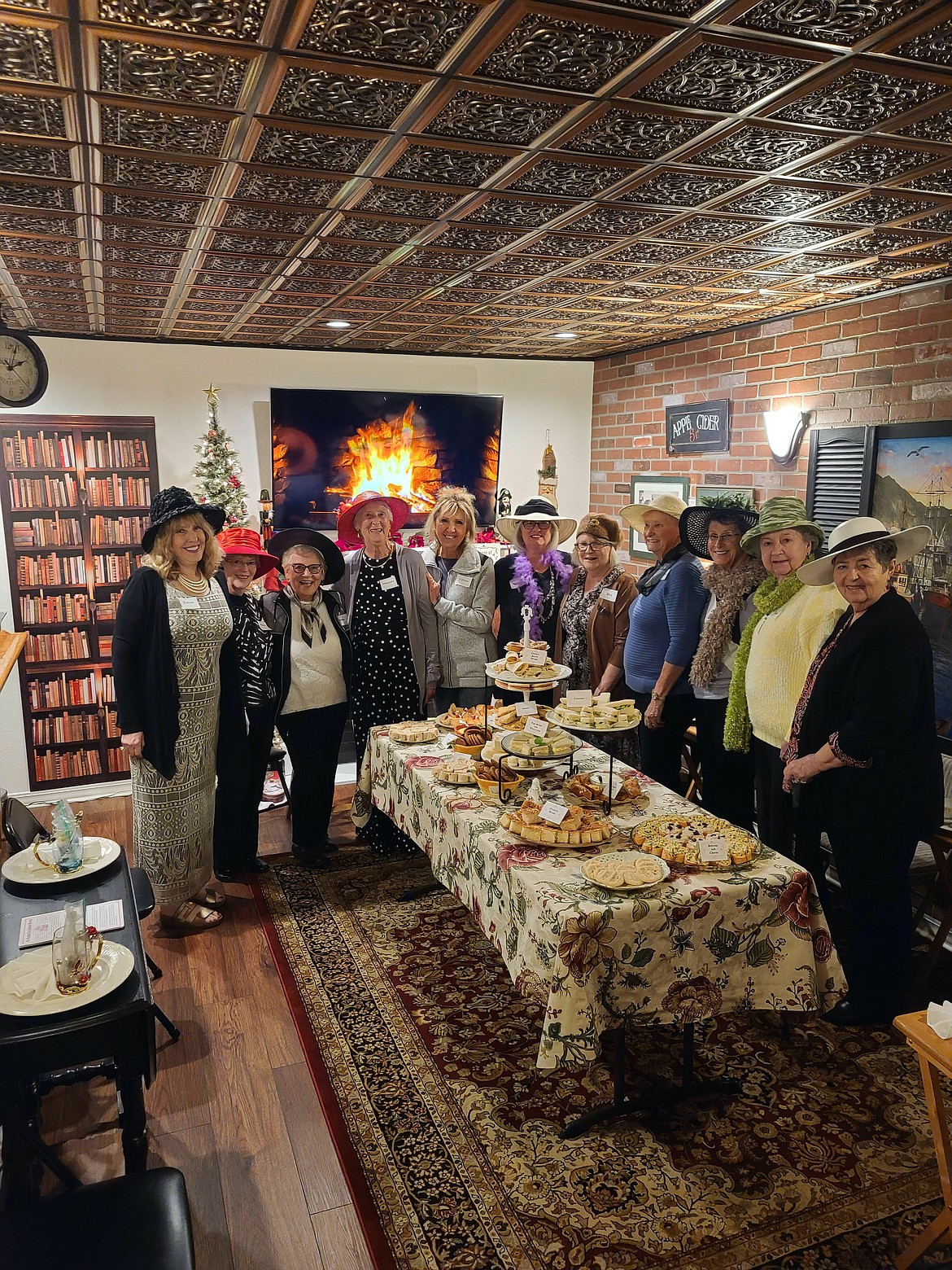 Vivienne Montague (pictured in the red hat) with a group of women from Easthaven Church at a tea held in her honor Oct. 29 at Jenean Hill's English Tea Room in Kalispell. (photo provided)