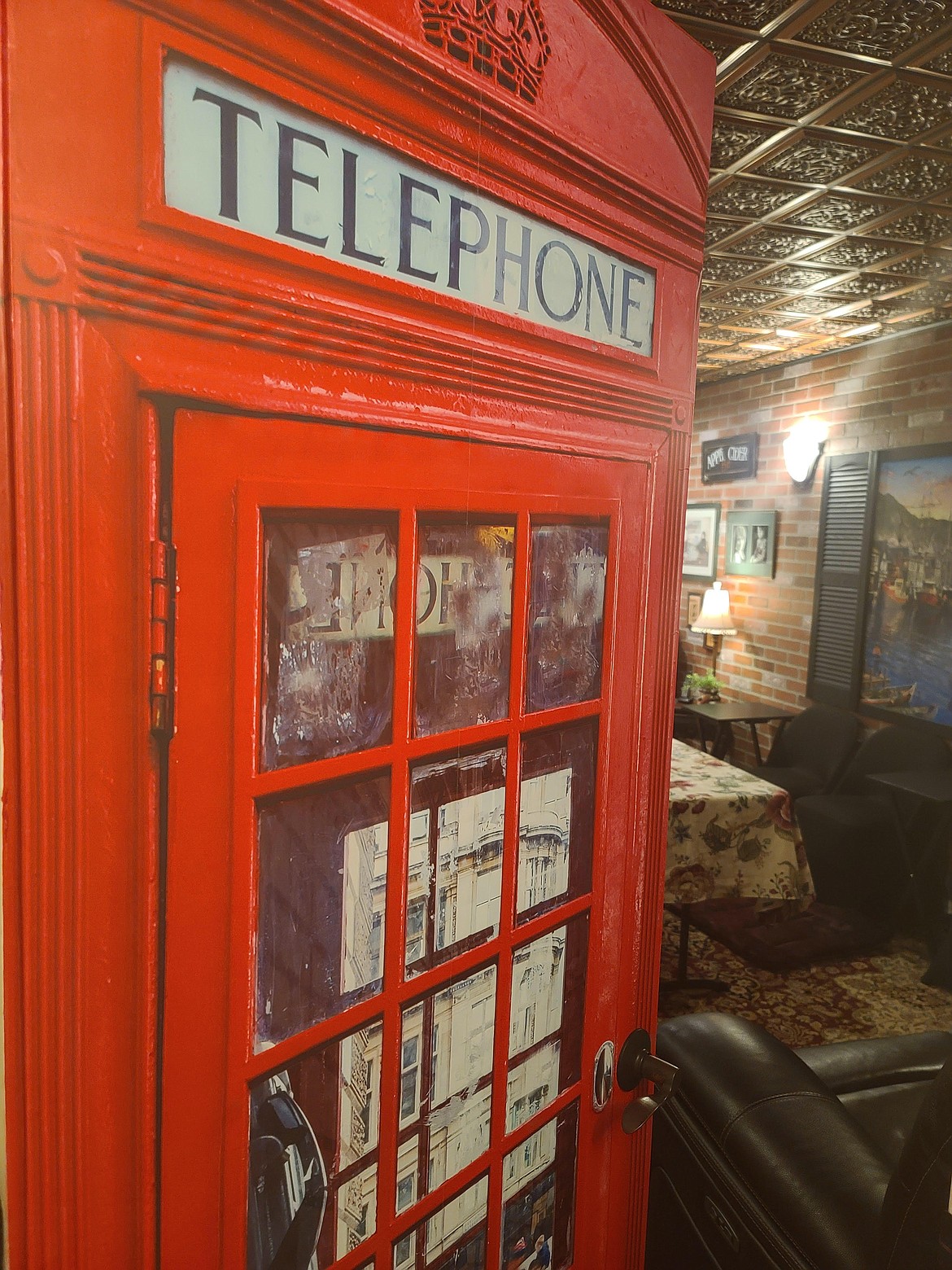 An English telephone booth decal decorates the entrance to the Hill House English Tea Room. (photo provided)