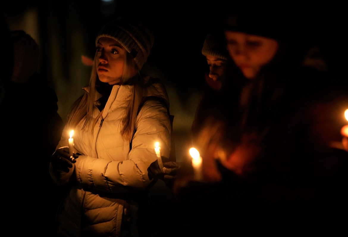 People attend a vigil at Independence Point on Wednesday to honor the four University of Idaho students who died in Moscow this week.
