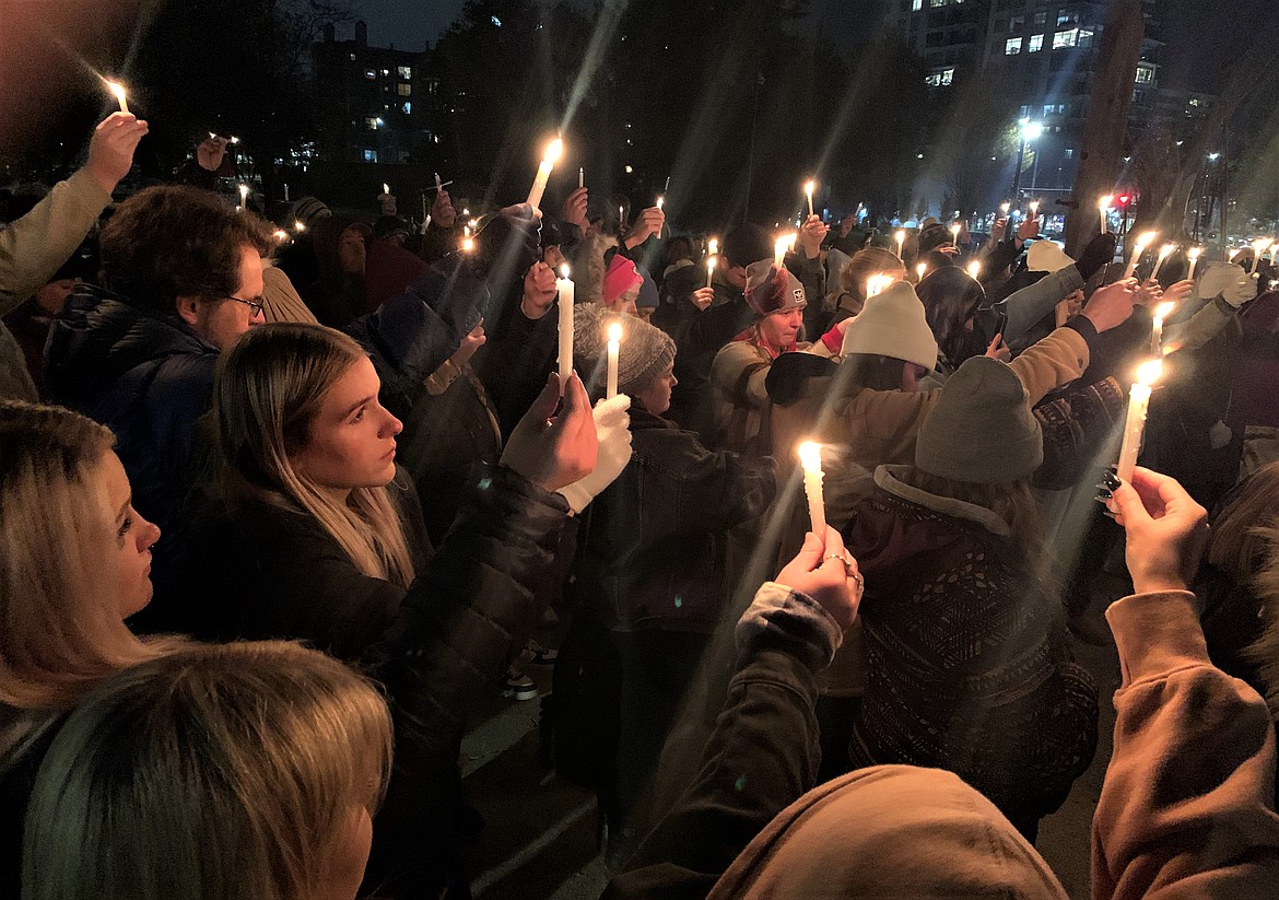 People attend a vigil at Independence Point on Wednesday to honor the four University of Idaho students who died in Moscow this week.