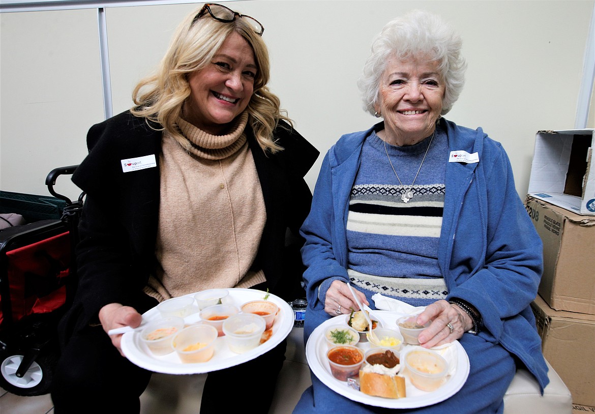 Josie Krahn and her mother Nila Krahn enjoy Souport the End of Homelessness on Thursday.