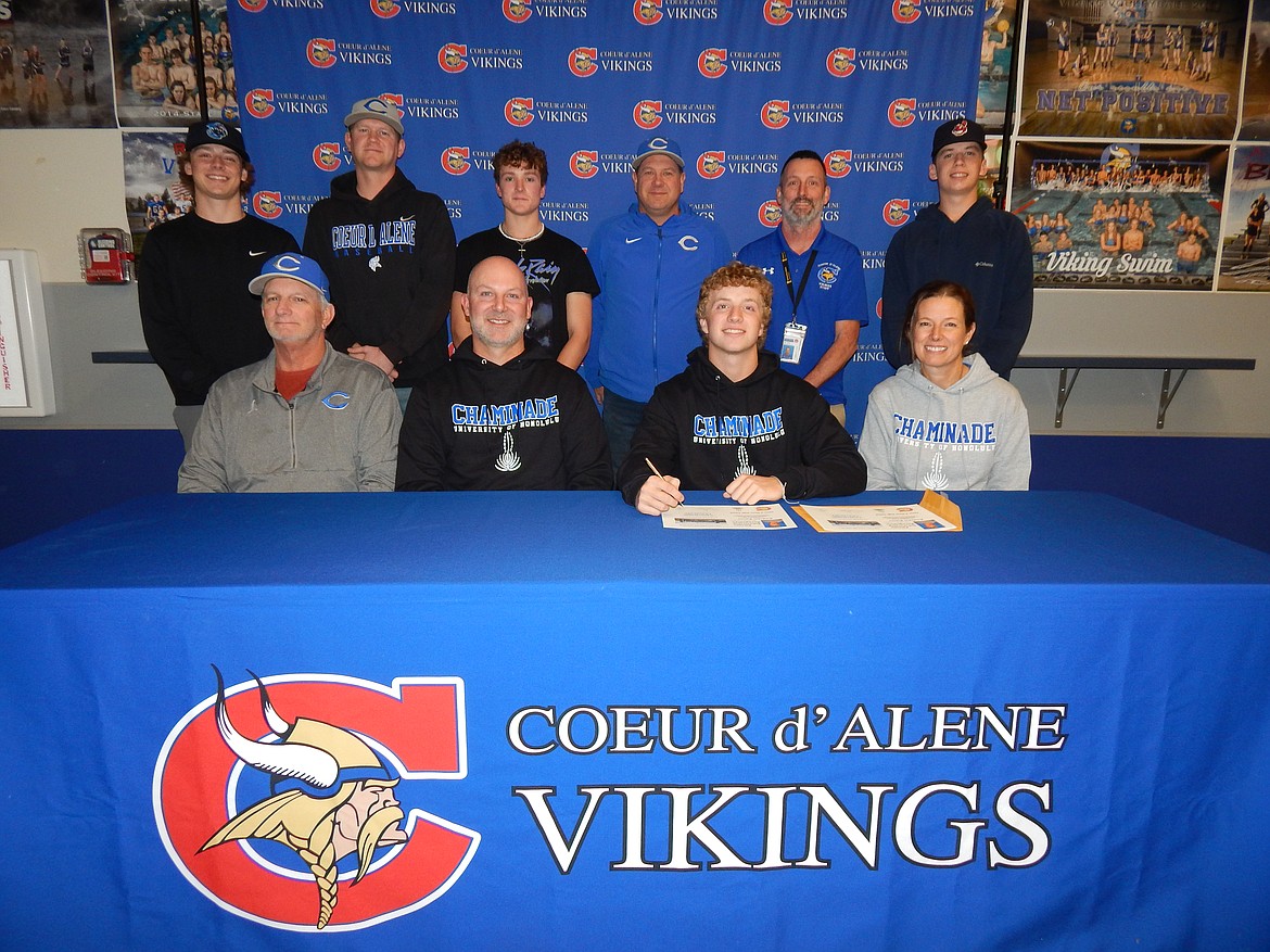 Courtesy photo
Coeur d'Alene High senior Andrew Karns recently signed a letter of intent to play baseball at NCAA Division II Chaminade University in Honolulu, Hawaii. Seated from left are Mike Borowski, Coeur d'Alene High assistant baseball coach; Erik Karns, dad and Coeur d'Alene High head baseball coach; Andrew Karns and Rachel Karns, mom; and standing from left, Cooper Erickson, teammate; Andy Beaudry, Coeur d'Alene High assistant baseball coach; Kyle Bridge, teammate; Brian Holgate, Coeur d'Alene High assistant baseball coach; Bill White, Coeur d'Alene High athletic director; and Jesse Brown, teammate.