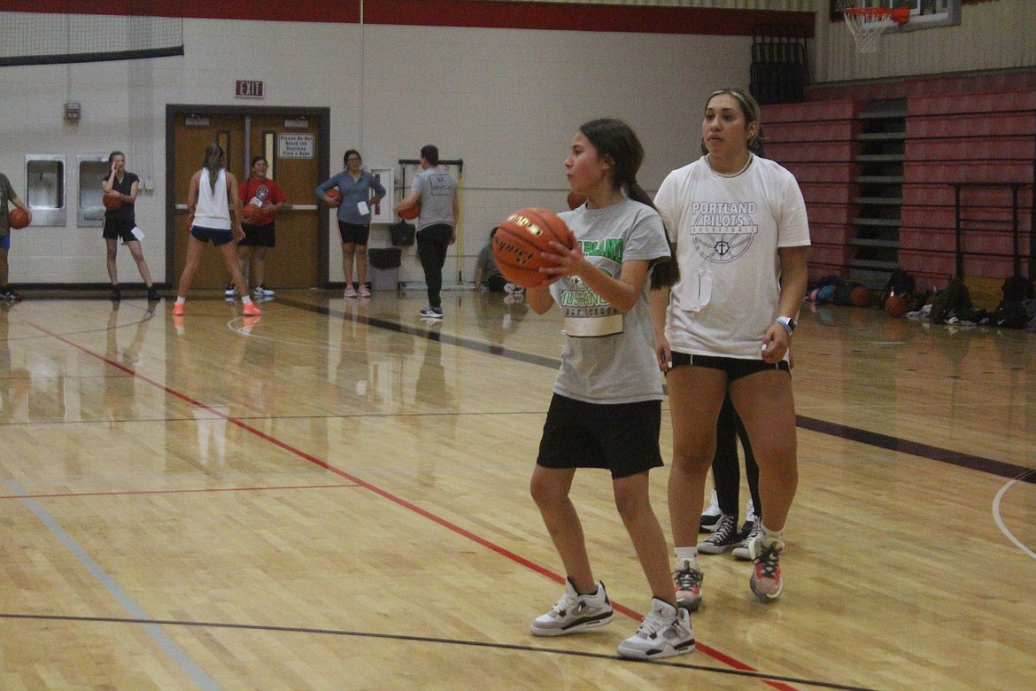 An Othello player prepares to pass the ball during practice.