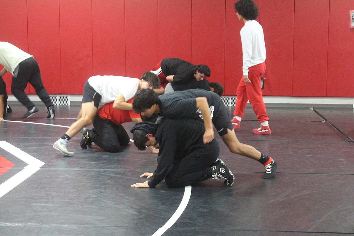 Othello wrestlers work on their technique.