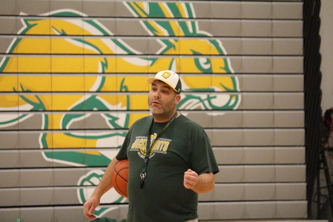 Head Coach Scott Bierlink gives instructions during a recent Quincy Jacks basketball practice.