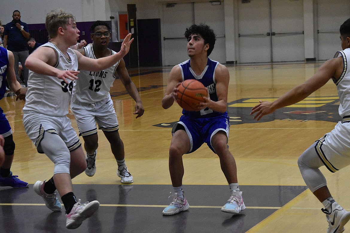 MLCA/CCS defenders crash in on a Soap Lake player during last year’s district tournament at Wenatchee High School.