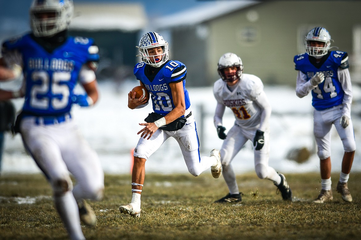 Mission quarterback Kellen McClure (10) takes off running in the first quarter against Belt during the 8-man championship at St. Ignatius High School on Saturday, Nov. 19. (Casey Kreider/Daily Inter Lake)