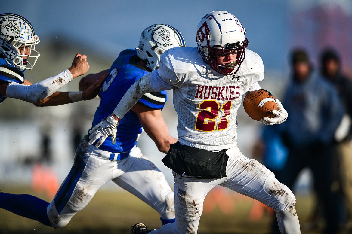 Belt running back Jeremy Nebel (21) picks up yardage on a run in the third quarter against Mission during the 8-man championship at St. Ignatius High School on Saturday, Nov. 19. (Casey Kreider/Daily Inter Lake)