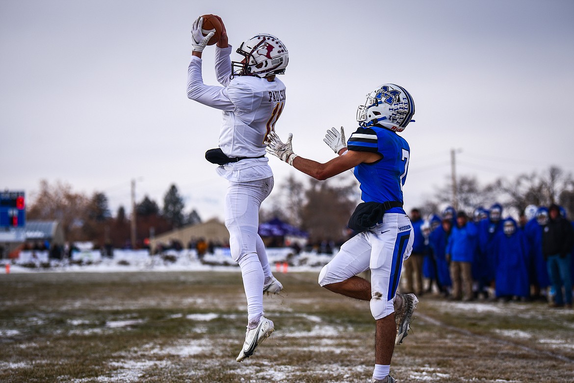 Belt defensive back Reese Paulson (11) intercepts a pass in the end zone in front of Mission wide receiver Iyezk Umphrey (7) in the first quarter during the 8-man championship at St. Ignatius High School on Saturday, Nov. 19. (Casey Kreider/Daily Inter Lake)