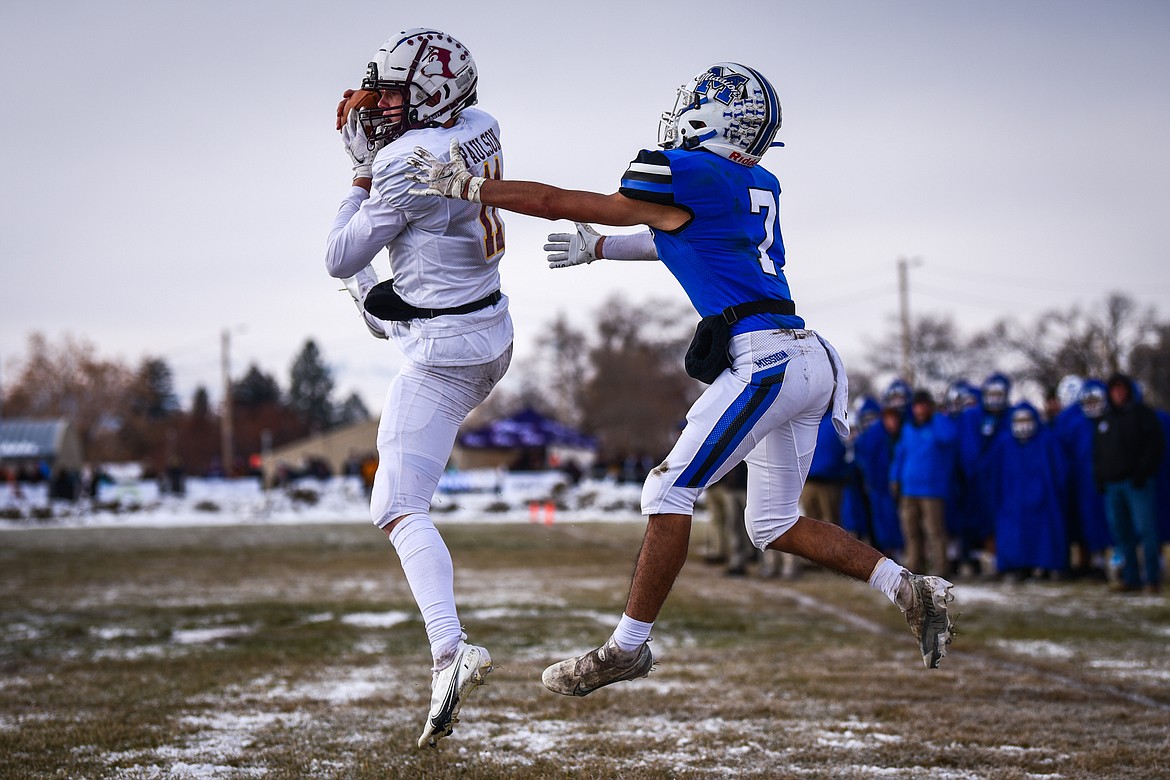 Belt defensive back Reese Paulson (11) intercepts a pass in the end zone in front of Mission wide receiver Iyezk Umphrey (7) in the first quarter during the 8-man championship at St. Ignatius High School on Saturday, Nov. 19. (Casey Kreider/Daily Inter Lake)