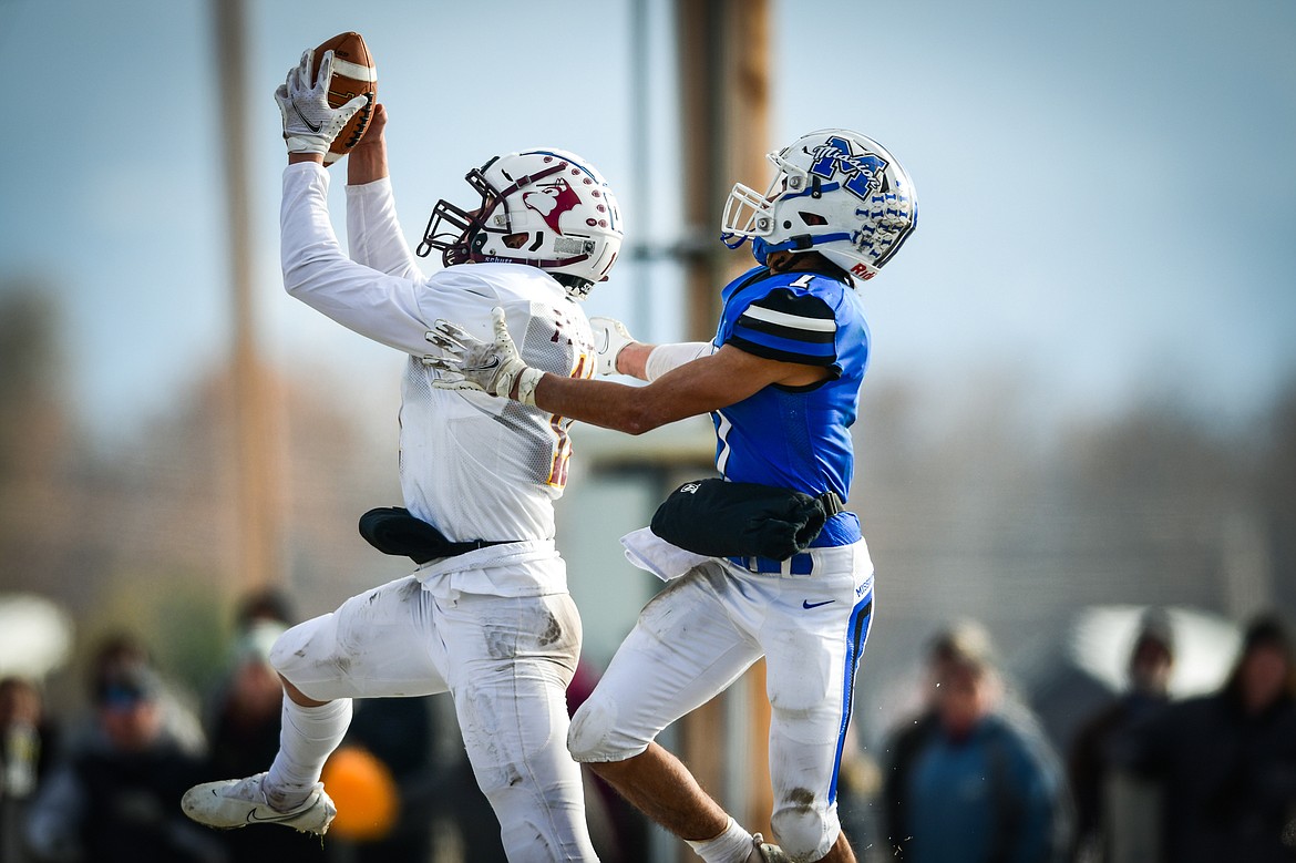 Belt defensive back Reese Paulson (11) intercepts a pass intended for Mission wide receiver Iyezk Umphrey (7) in the first quarter during the 8-man championship at St. Ignatius High School on Saturday, Nov. 19. (Casey Kreider/Daily Inter Lake)