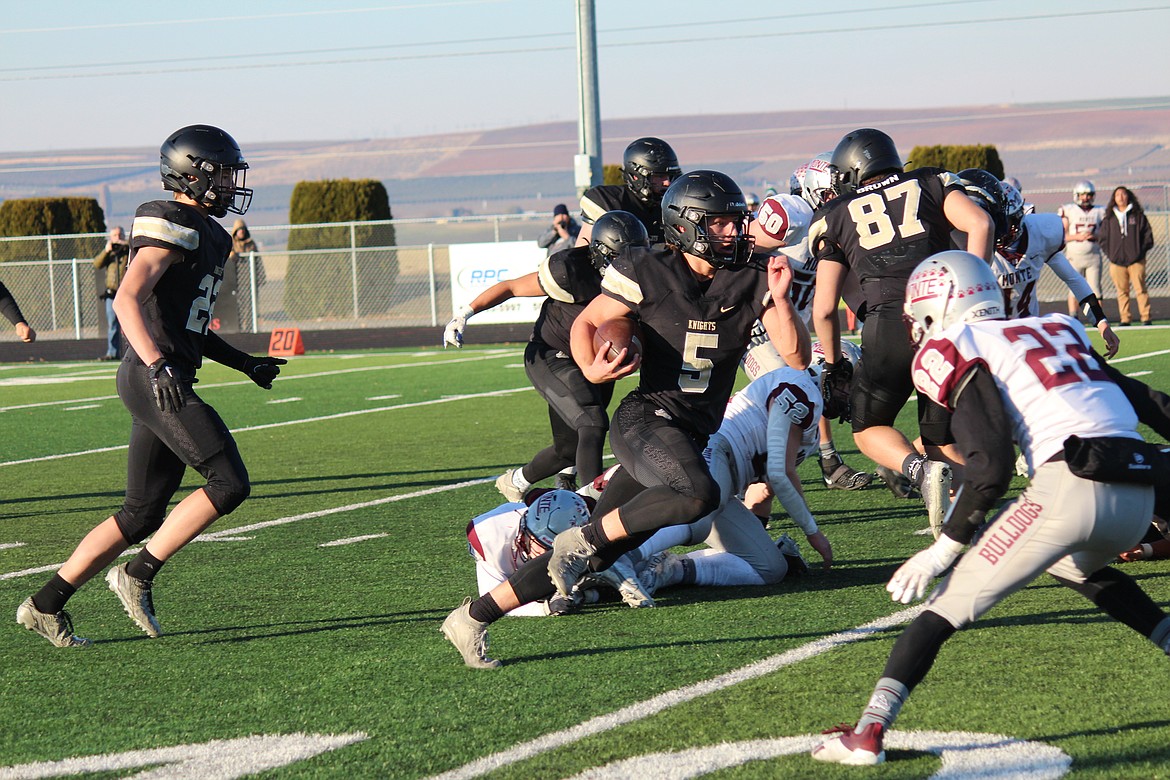 Royal quarterback Dylan Allred (5) threw three touchdown passes and rushed for two scores in Royal’s 41-9 win over Montesano on Saturday.