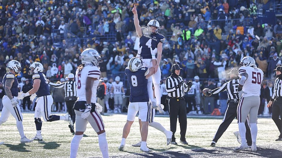 The Montana State University Bobcats celebrate a touchdown against the Montana Grizzlies on Saturday at Bobcat Stadium in Bozeman.