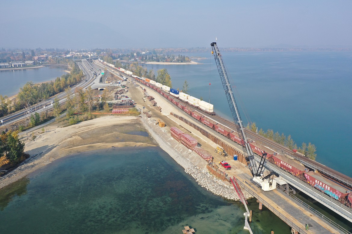 Railroad cars can be seen on both the newly constructed railroad bridge and the existing BNSF Railway bridge across Lake Pend Oreille in mid-October.