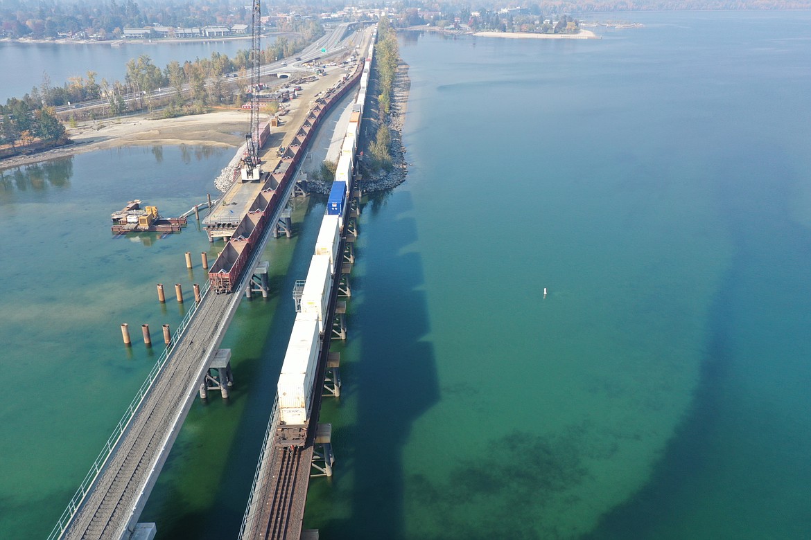 Railroad officials announced Monday that the Sandpoint Junction Connector bridge across Lake Pend Oreille saw its first rail traffic on Sunday. Above, railroad cars can be seen on both the newly constructed railroad bridge and the existing BNSF Railway bridge in mid-October.