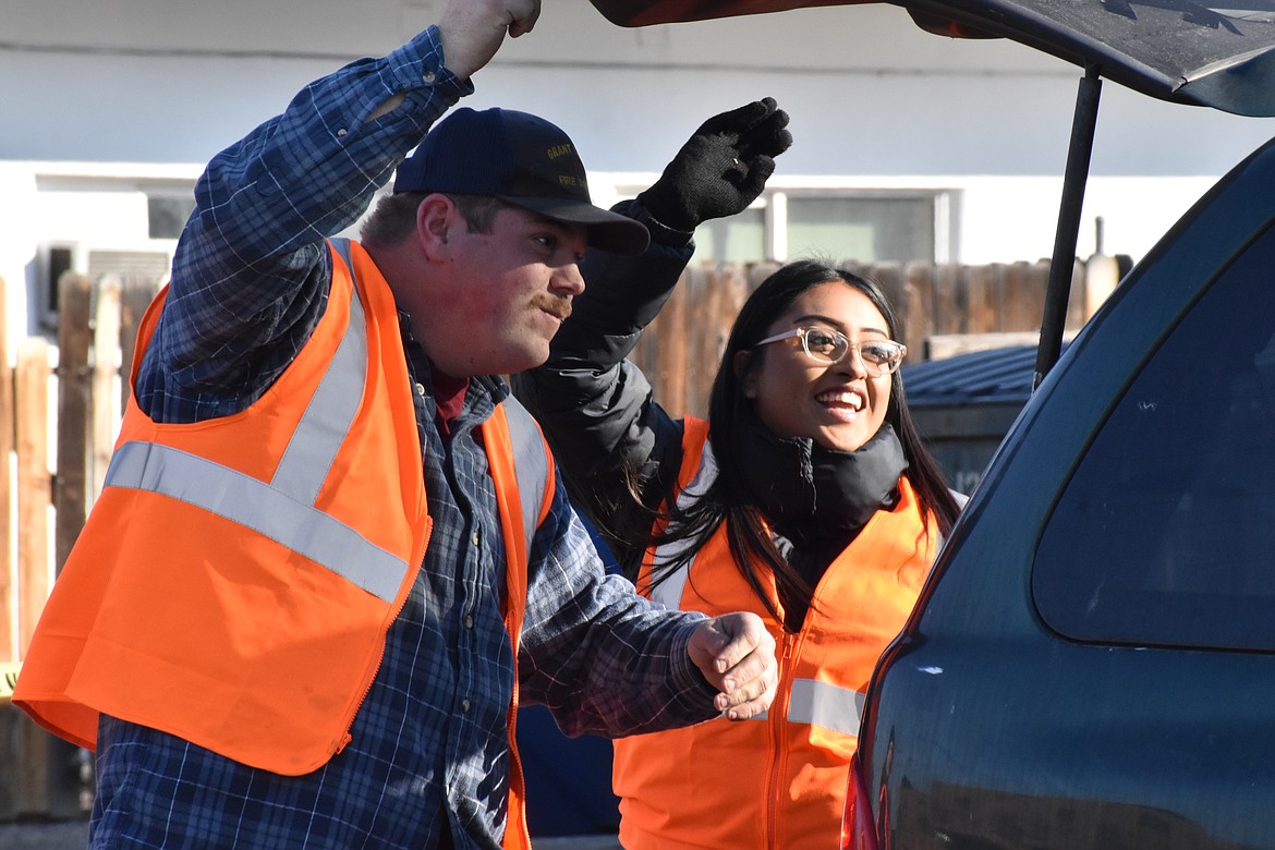 Volunteers at the Moses Lake Food Bank had a great time loading up cars with food as they came through.