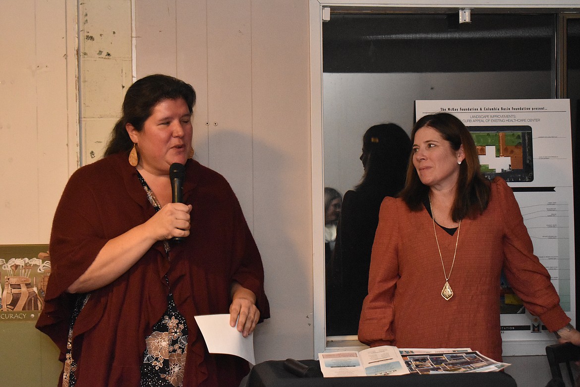 Administrator for McKay Healthcare and Rehabilitation Erica Gaertner, left, speaks to guests at the second annual Gathered in Gratitude fundraiser at the Lakeview Golf and Country Club on Sunday. Corinne Isaak, executive director of the Columbia Basin Foundation, right, spoke shortly after Gaertner.