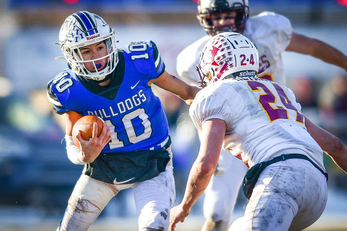 Mission quarterback Kellen McClure (10) looks for running room in the third quarter against Belt during the 8-man championship at St. Ignatius High School on Saturday, Nov. 19. (Casey Kreider/Daily Inter Lake)