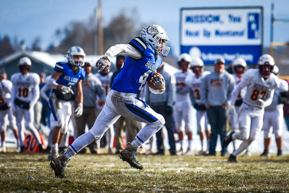 Misson defensive lineman Chance Bockman (42) returns an interception for a touchdown in the second quarter against Belt during the 8-man championship at St. Ignatius High School on Saturday, Nov. 19. (Casey Kreider/Daily Inter Lake)