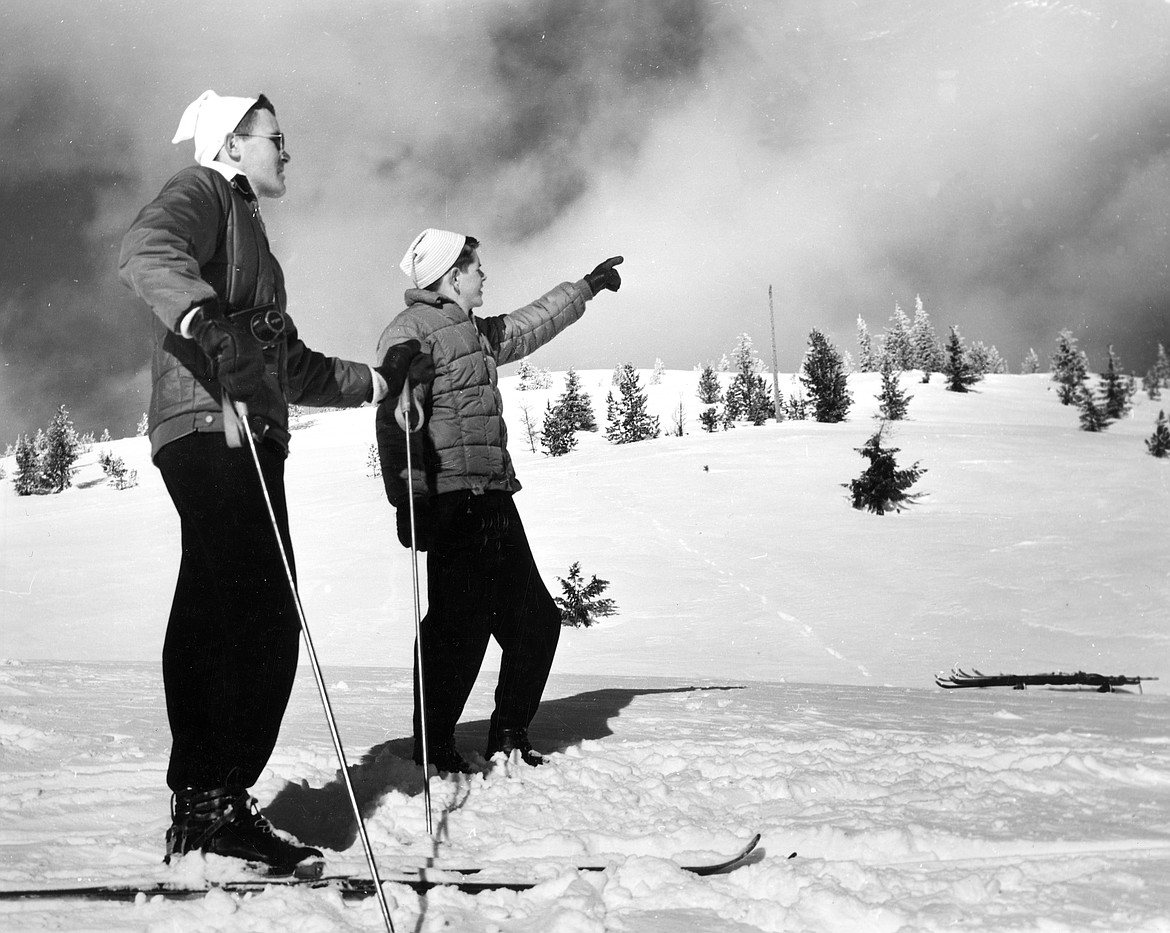 Two skiers enjoy the slopes on Big Mountain. (Photo by Marion Lacy, courtesy of Whitefish Mountain Resort)
