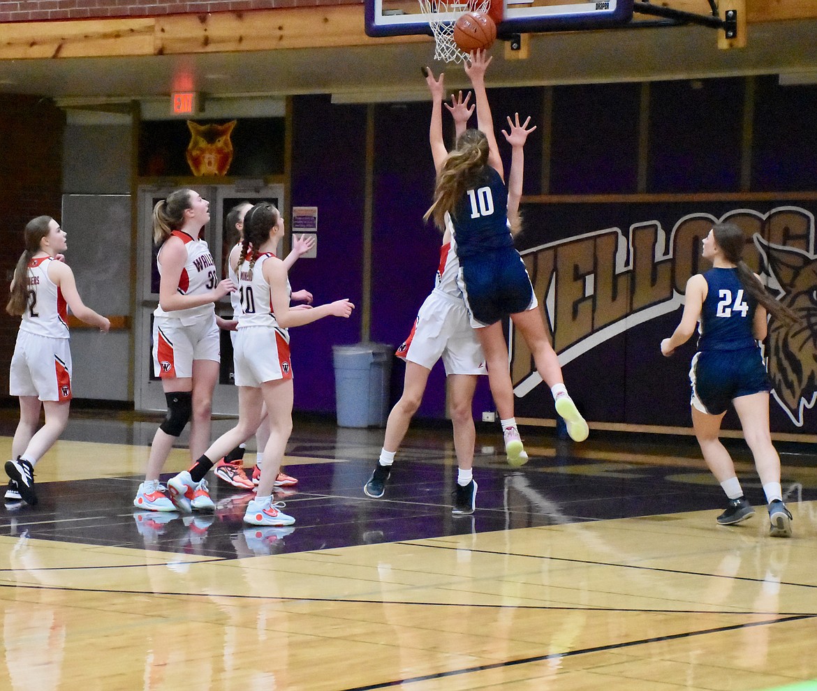 Markynn Pluid shoots a lay-in against Sandpoint at the Silver Valley Tournament.