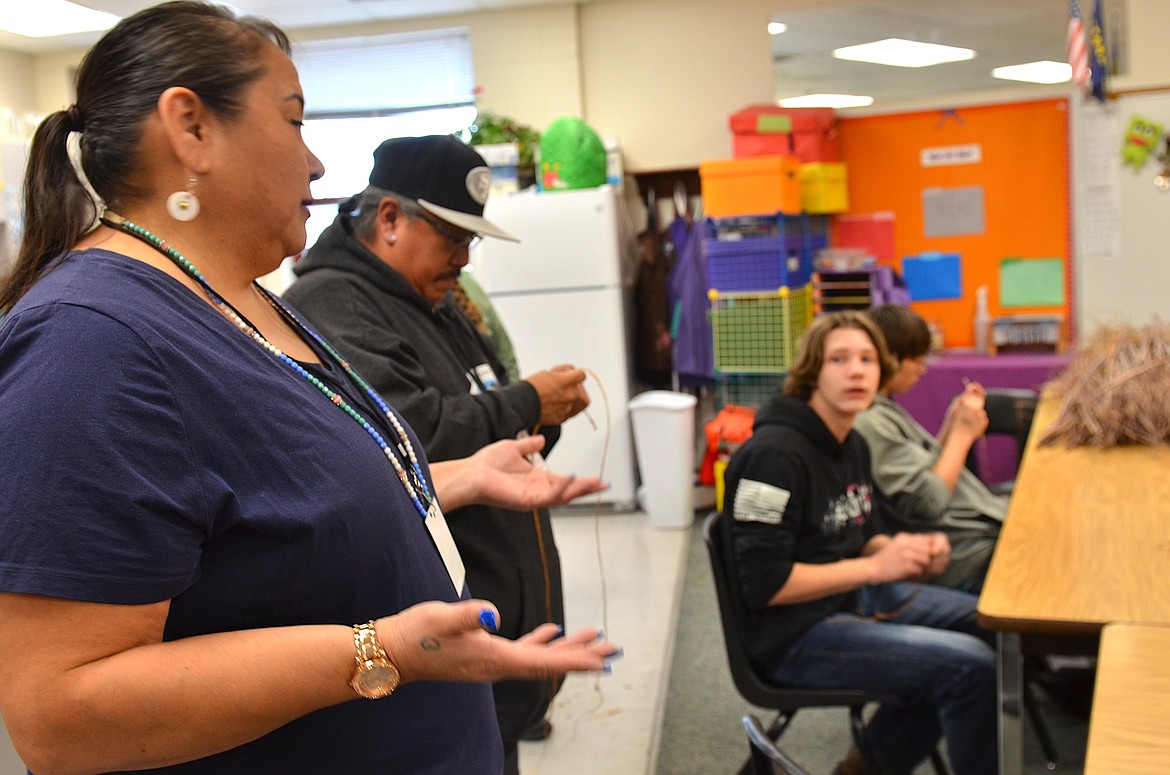 Jan Gardipe, who teaches at Salish Kootenai College, shows Polson Middle School students how to make rope out of strips of dogbane, a traditional winter activity, during Native American Heritage Day. (Kristi Niemeyer/Lake County Leader)