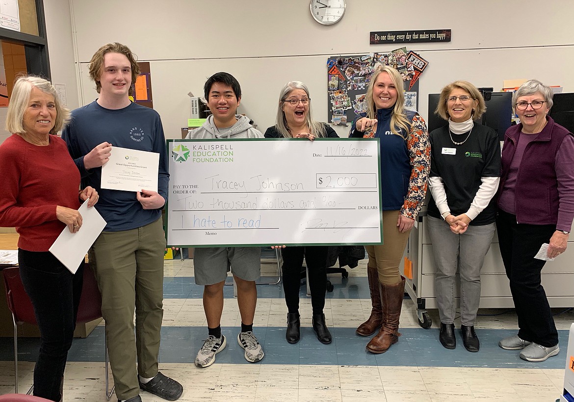 Kalispell Education Foundation (KEF) presents Flathead High School librarian Tracey Johnson with a $2,000 Great Opportunities grant. Pictured left to right: KEF board member Carol Santa, KEF student board representatives Ian Lawson-Sanderlin and Vincent Lam, Johnson, Glacier Bank representative and grant project sponsor Libby Fields, and KEF board members Dr. Lynn Dykstra and Sue Brown. (Photo provided by Dorothy Drury)