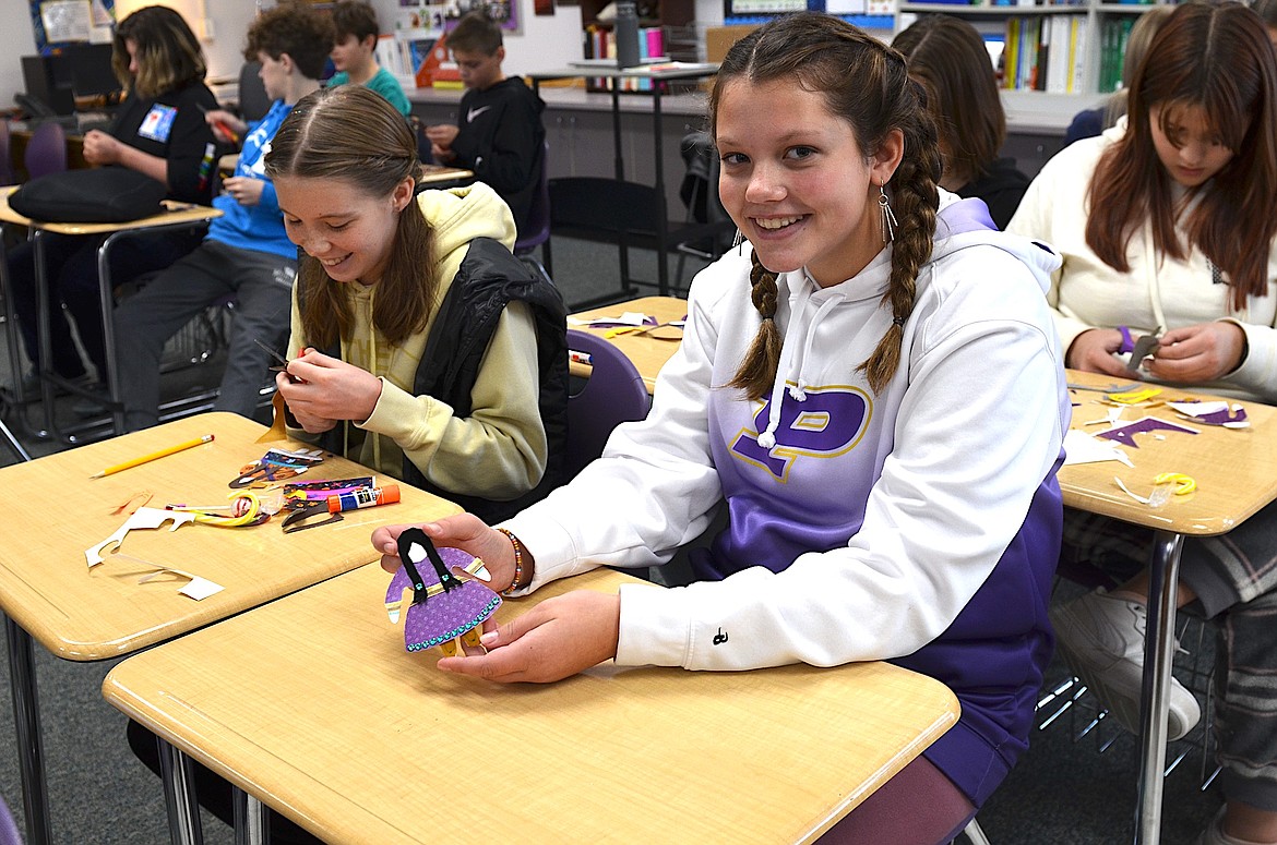 Eighth graders Morgan Delaney and Karly Smith learn about traditional Indigenous dress during a Native American Heritage Day session with D’Arcy Ellis. (Kristi Niemeyer/Lake County Leader)