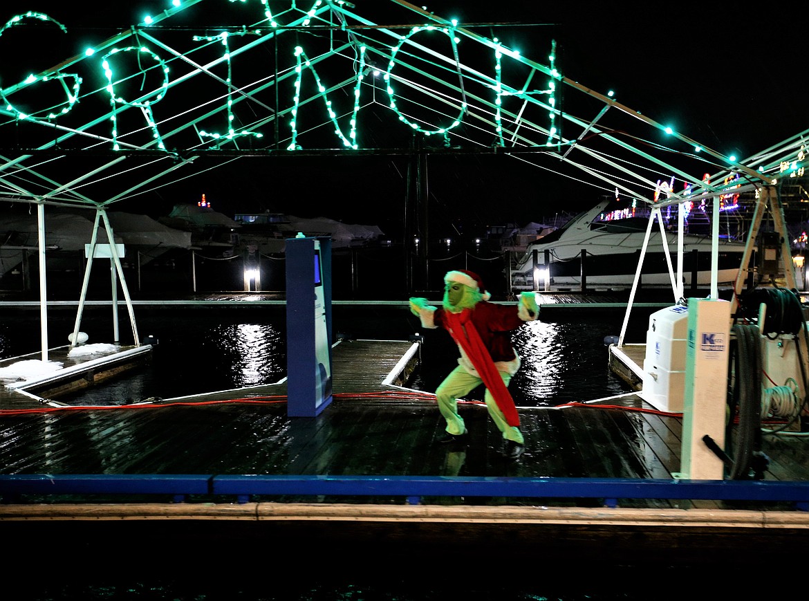 The Grinch yells as The Journey to the North Pole heads out Tuesday night from The Coeur d'Alene Resort.