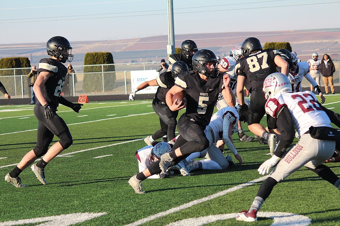 Royal quarterback Dylan Allred advances the ball upfield in the Knights’ 41-9 win over Montesano on Saturday. The Knights will look to advance to their third-consecutive 1A state title game with a semifinals matchup against Freeman on Saturday.