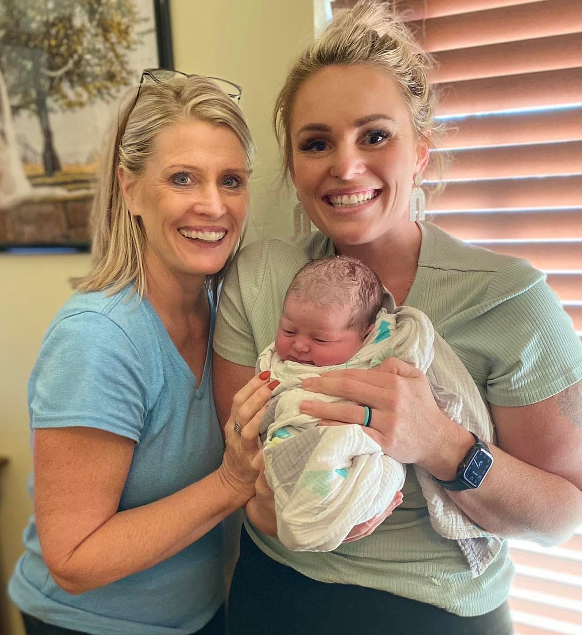 Inga Arts and daughter Bekah Fanciullo celebrate the birth of Mia, Fanciullo's first delivery as a midwife student, on Sept. 19.
