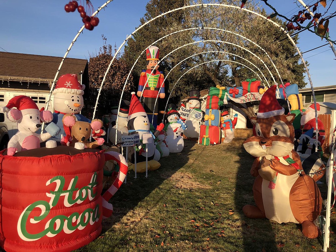 The Coulters take the opportunity to collect donations for the Boys and Girls Club at their yard display. This year the display includes 75 inflatables, 30 walk-through arches and roughly 15,000 electric lights. “The PUD likes us,” Alan Coulter joked.