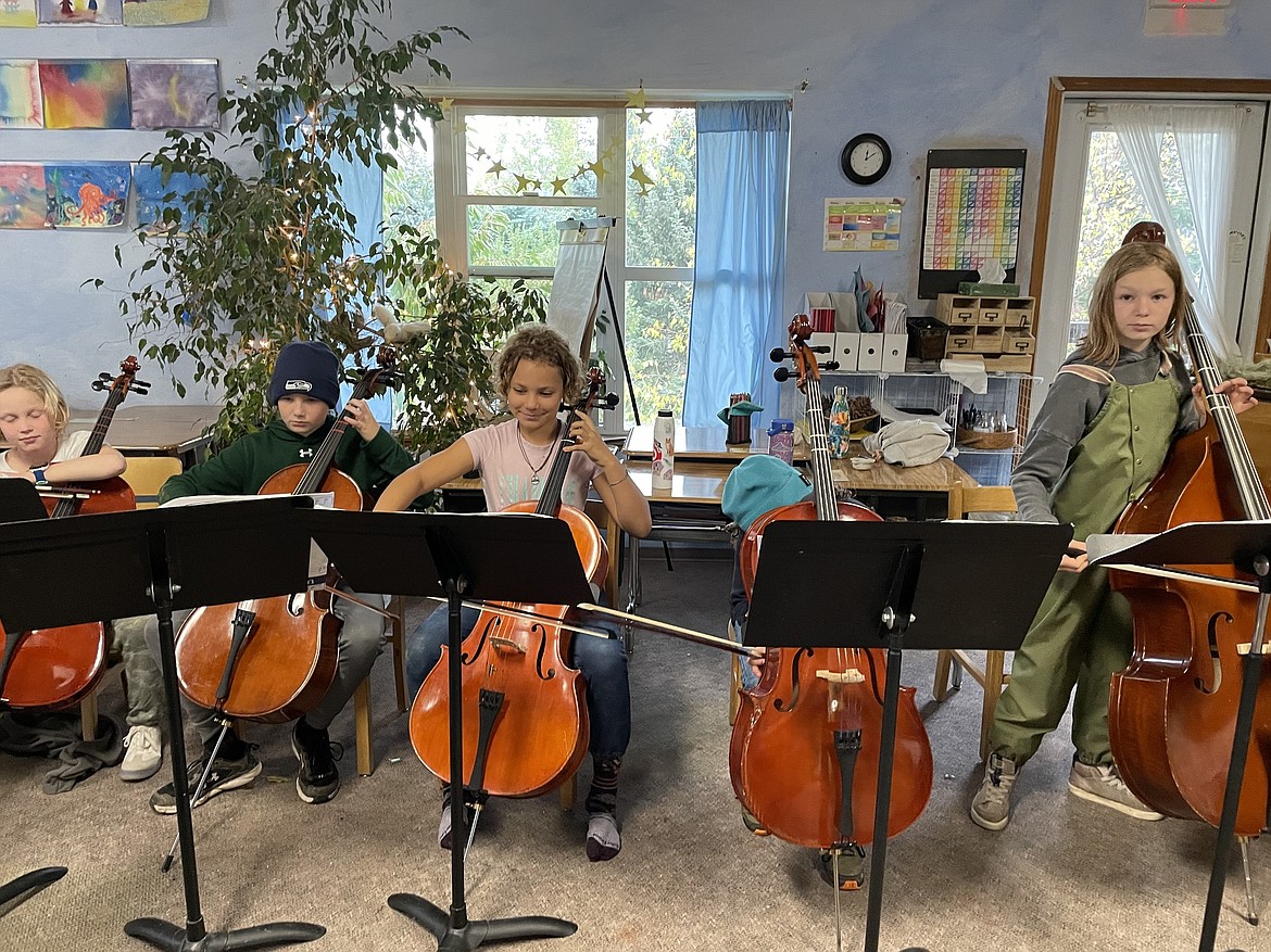 Sandpoint Waldorf School fifth graders tune and practice their cellos during a recent class. The school's students recently shared the many things for which they are grateful.