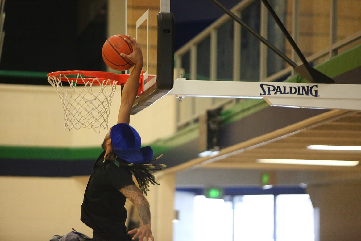 Big Bend sophomore Keenan Miller rises up to dunk the ball during a Viking practice.