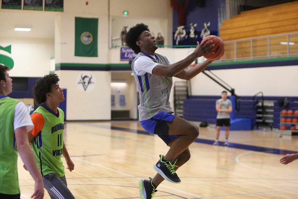 Big Bend players begin practices by working on layups and driving to the basket.