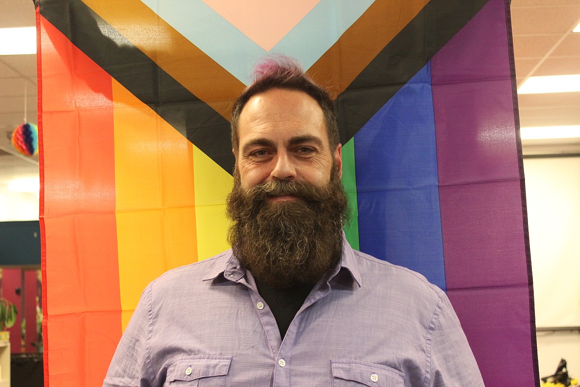 Bryan Bebb, executive director of the Glacier Queer Alliance, in the group's Kalispell office. (Taylor Inman/Daily Inter Lake)