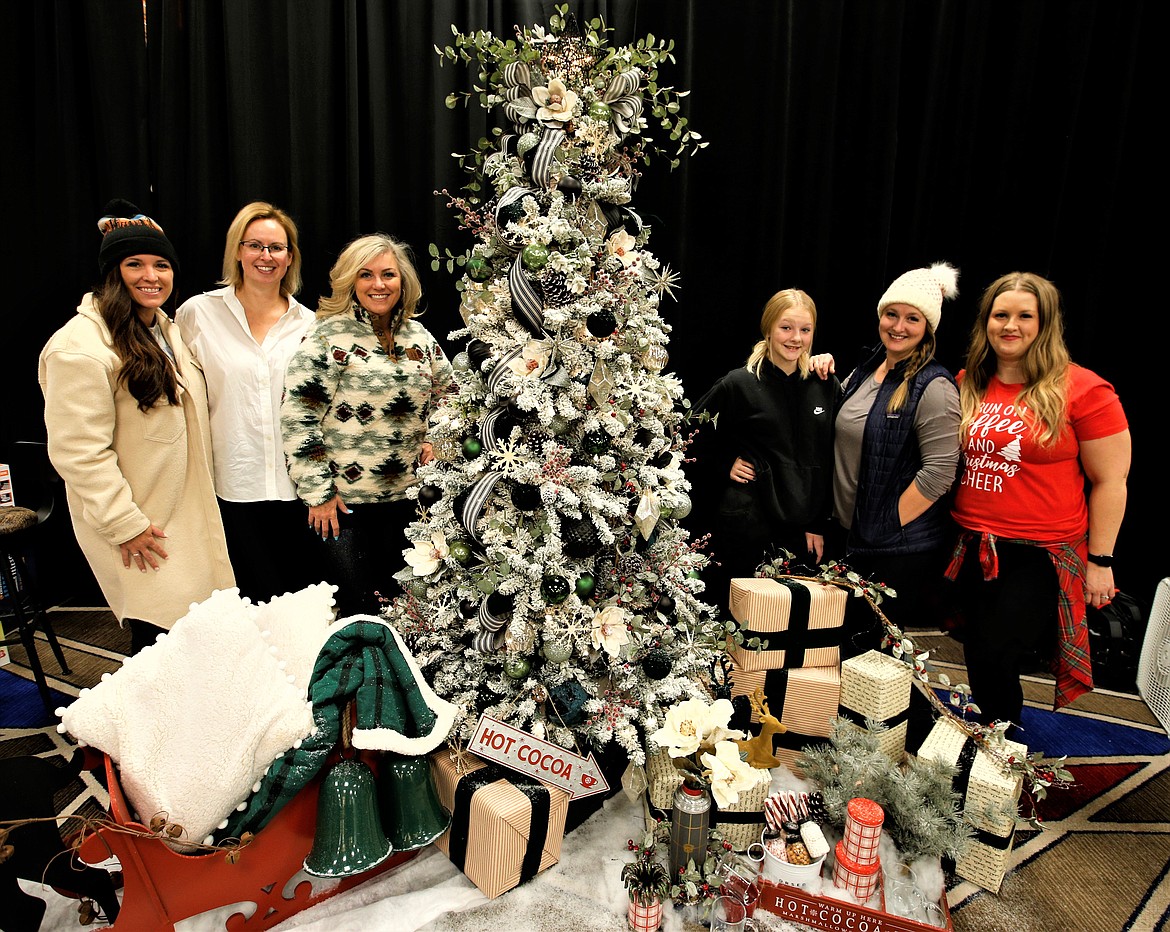 The team behind the "Evergreen Christmas" raffle tree for the Festival of Trees on Friday at The Coeur d'Alene Resort includes, from left, Megan Pelsma, Stormie Anderson, Tanya Jerome, Madison Valenta, Katie Valenta and Carrie (Randall) Rice-Sauer.