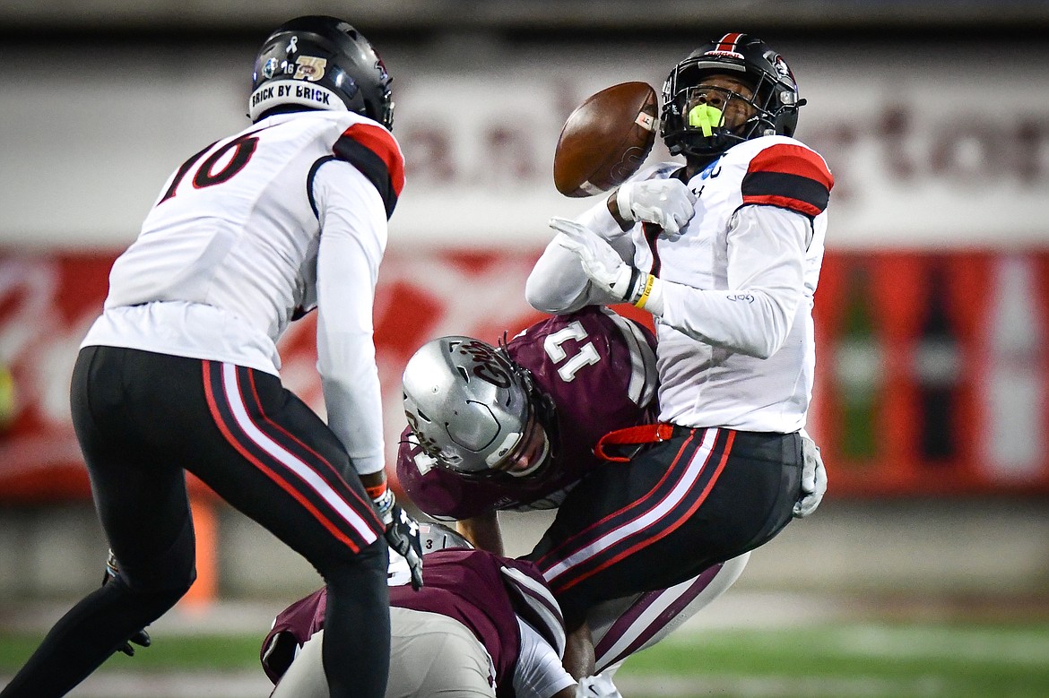 Grizzlies safety Robby Hauck (17) forces a fumble by Southeast Missouri State wide receiver Ryan Flourney (1) in the first half of an FCS playoff game at Washington-Grizzly Stadium on Saturday, Nov. 26. (Casey Kreider/Daily Inter Lake)