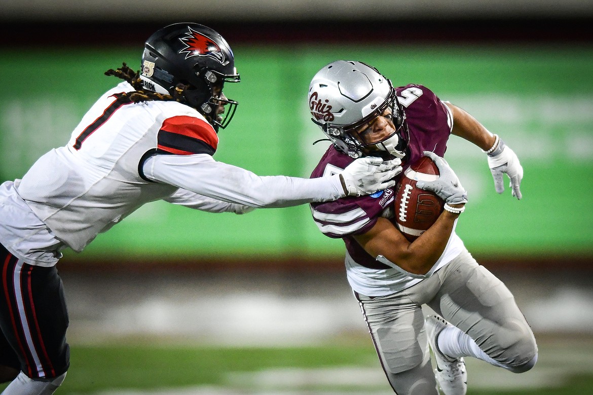 Grizzlies wide receiver Junior Bergen (5) sheds a tackle by Southeast Missouri State defensive back Lawrence Johnson (7) on a run in the fourth quarter of an FCS playoff game at Washington-Grizzly Stadium on Saturday, Nov. 26. (Casey Kreider/Daily Inter Lake)